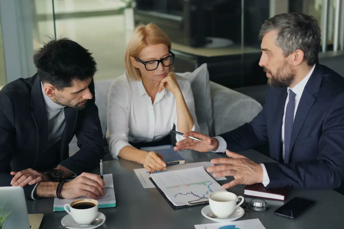 A team going through their work together at a table