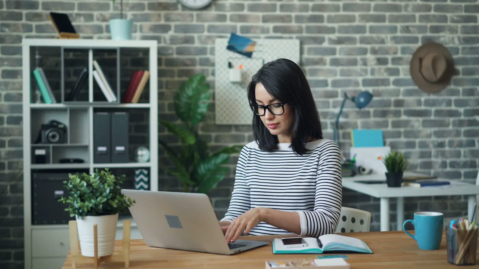 An accountant working at a laptop in an office
