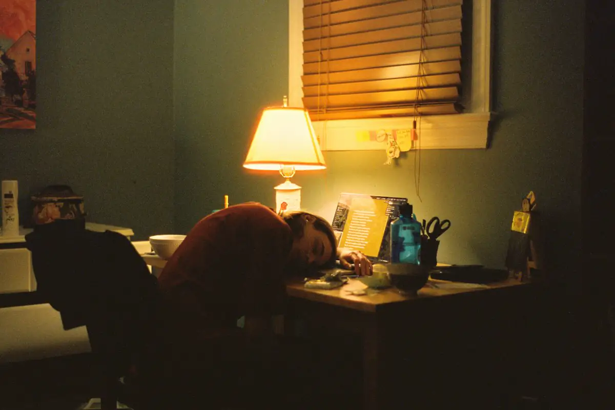 A business owner doing paperwork alone at night