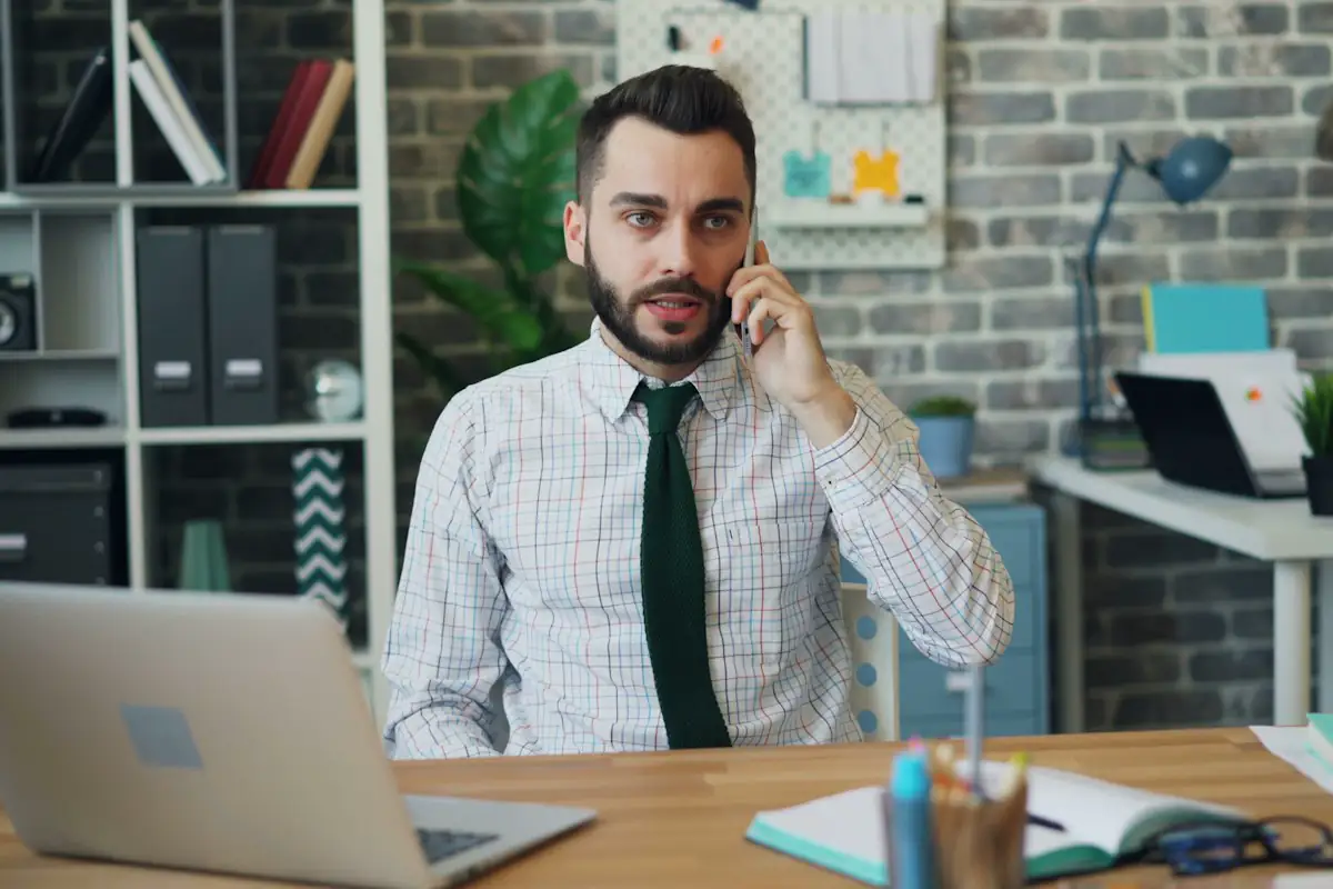 A loan officer at his desk making a call