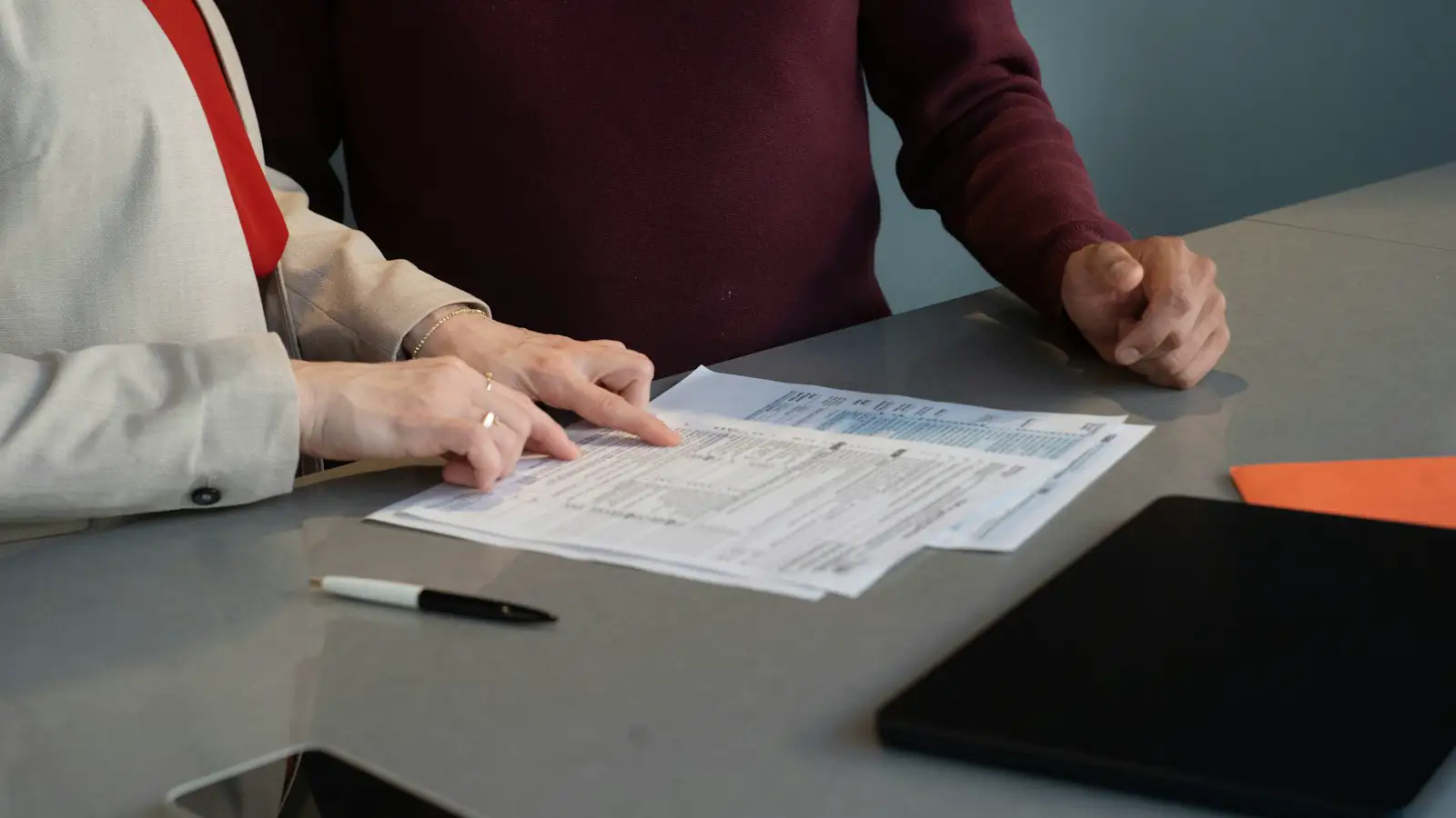 A tax preparer at a desk with a client